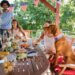 a family sitting around the table for the fourth of july eating food