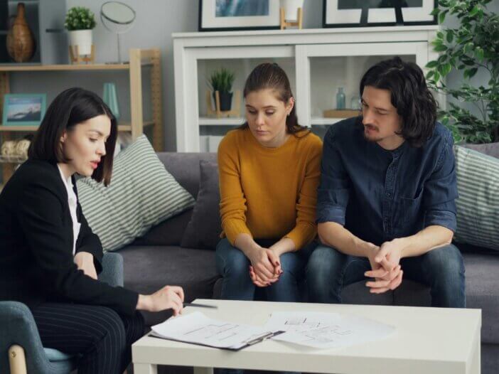 a couple with their attorney with their estate plan