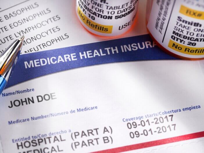 medicare documents and medicine bottles