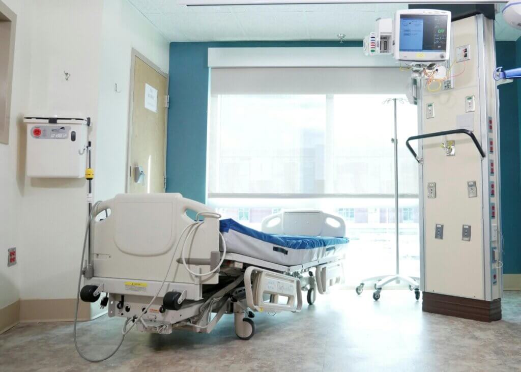 a hospital bed in the middle of a hospital room