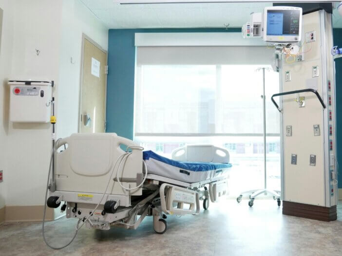 a hospital bed in the middle of a hospital room