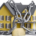 House with locks and chains around it.