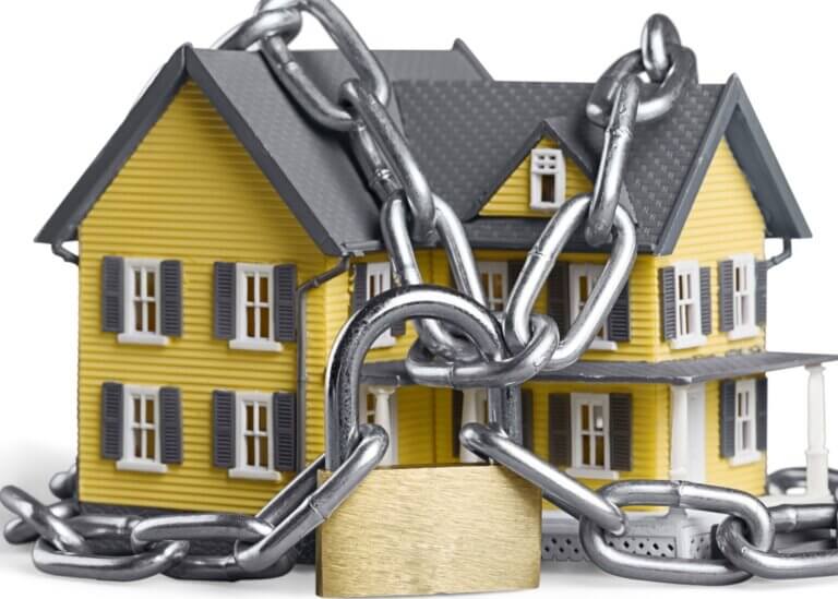 House with locks and chains around it.