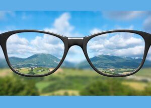 Looking through glasses to provide clarity.