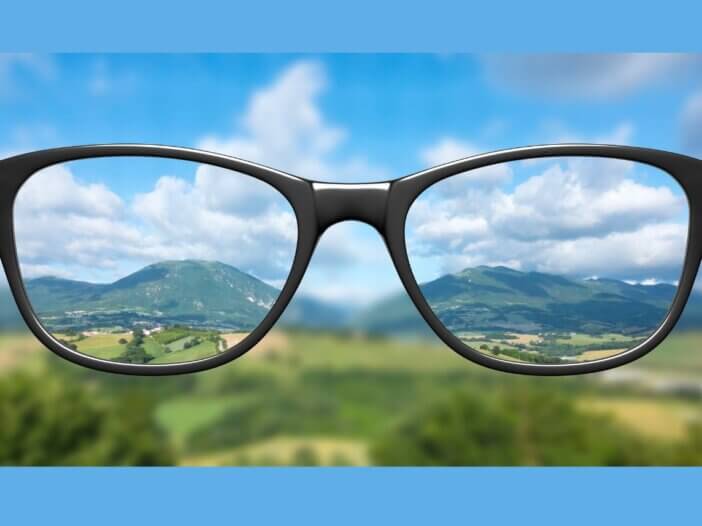Looking through glasses to provide clarity.