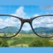 Looking through glasses to provide clarity.