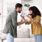siblings fighting and arguing in the living room