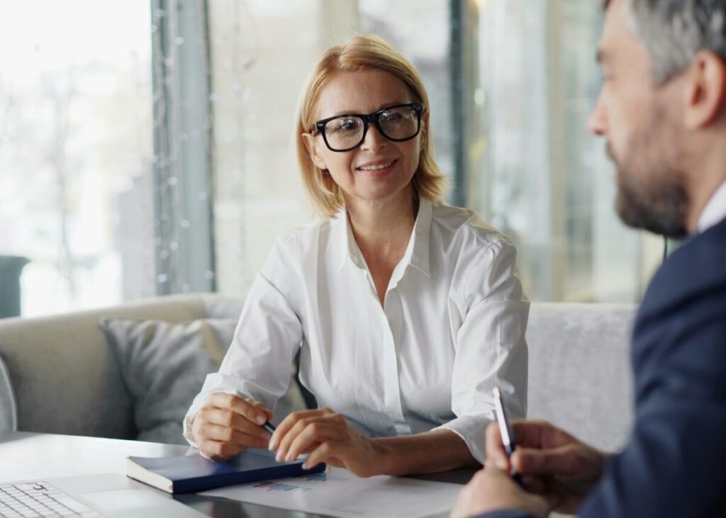 two people talking in a more serious setting