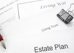 a picture of documents titled: living will, living trust, and estate plan