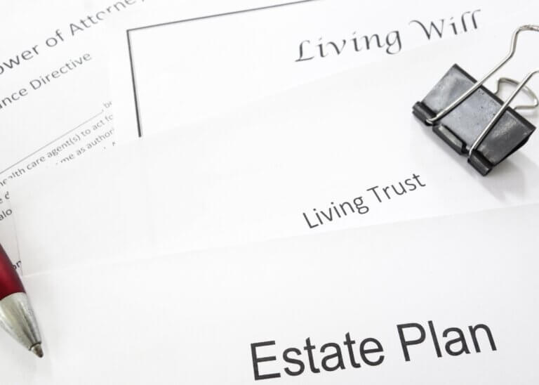 a picture of documents titled: living will, living trust, and estate plan