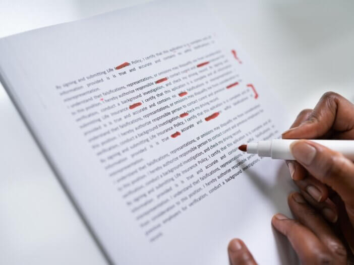 a person correcting a paper