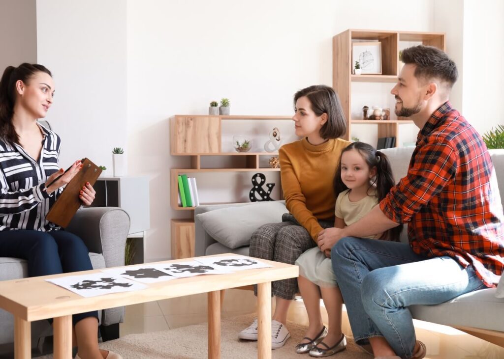 a family talking with their attorney and their child