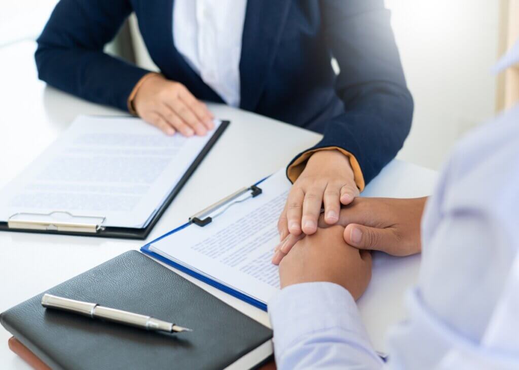 an advisor consoling their client