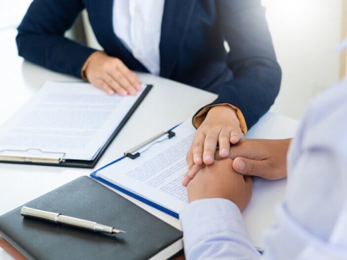 an advisor consoling their client