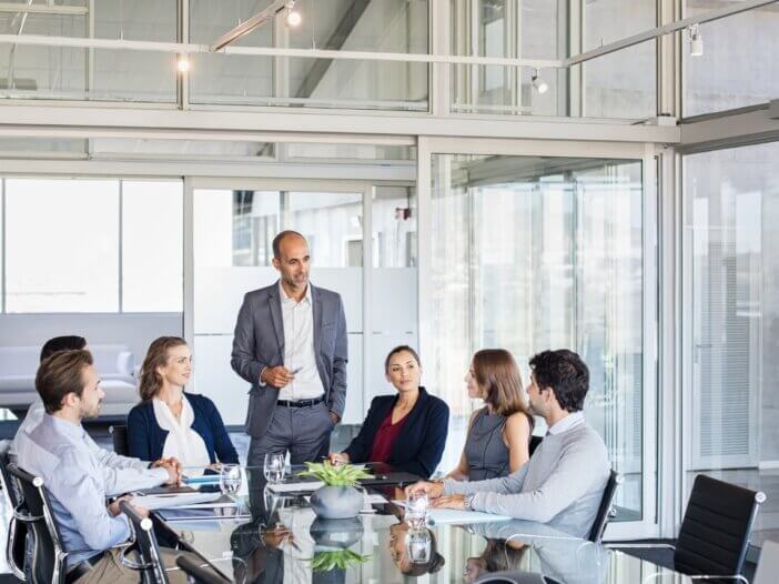 a family meeting in an office with their advisors