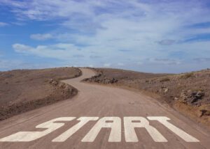 a windy dirt road that has the word start drawn into it at the beginning