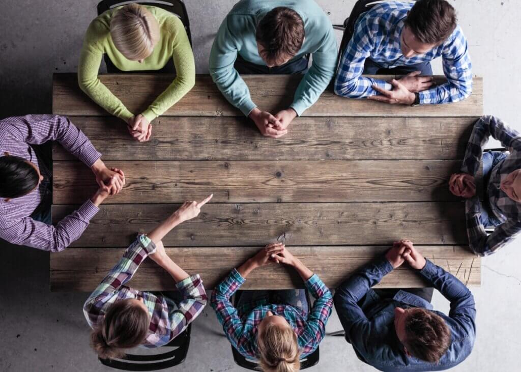 children sitting at a table strategizing