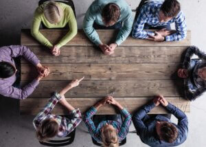 children sitting at a table strategizing