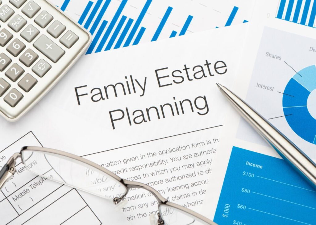 a picture of an estate plan and a trust with calculators and charts and all of that around it