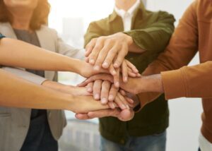a crowd on hands in a circle