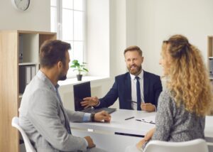 an advisor talking to his two clients