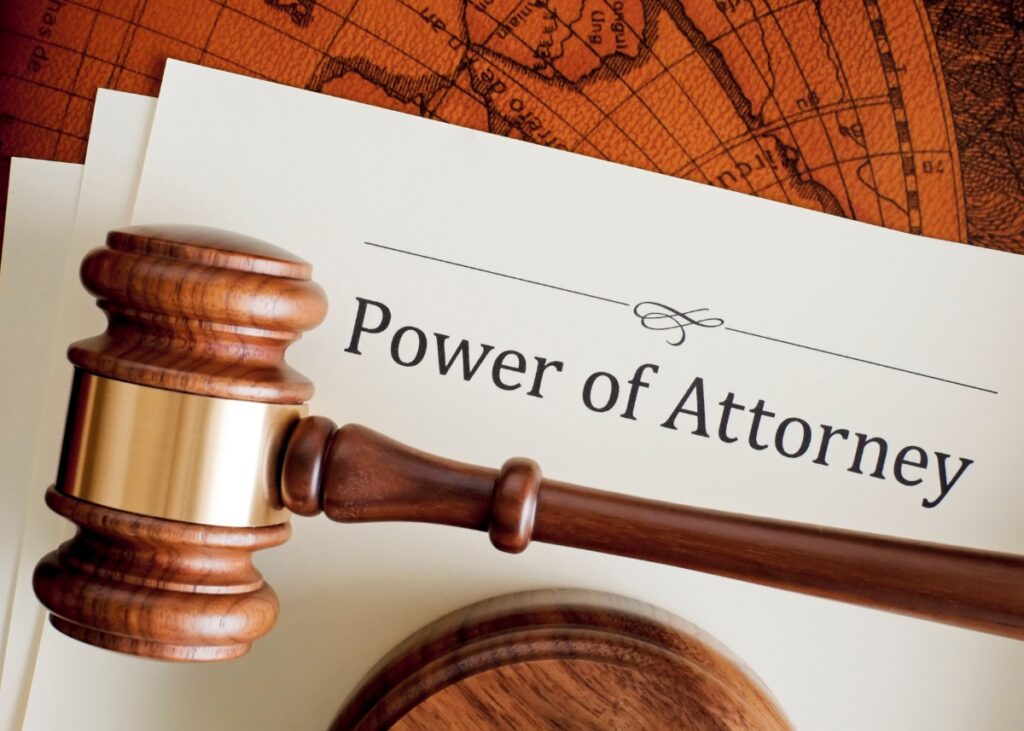 a picture of a power of attorney document and a gavel in front of it