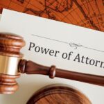 a picture of a power of attorney document and a gavel in front of it