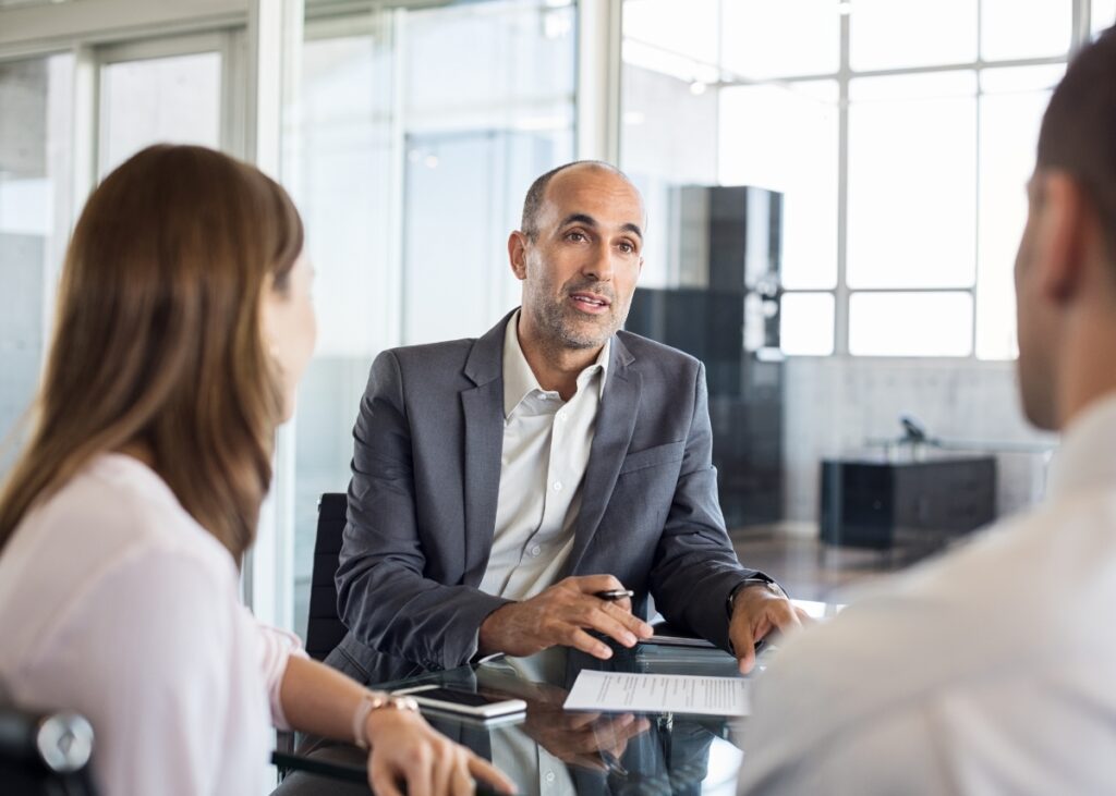 an advisor speaking with his clients in a crisis