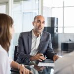 an advisor speaking with his clients in a crisis