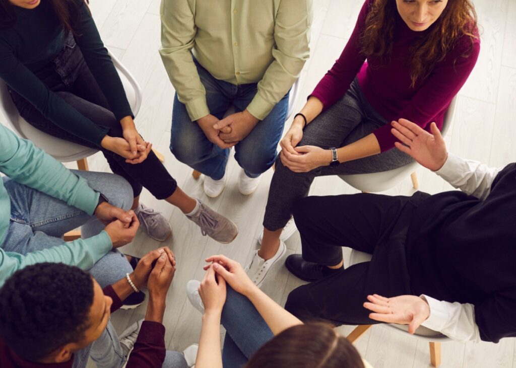 a circle of people in a support group