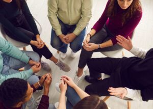 a circle of people in a support group