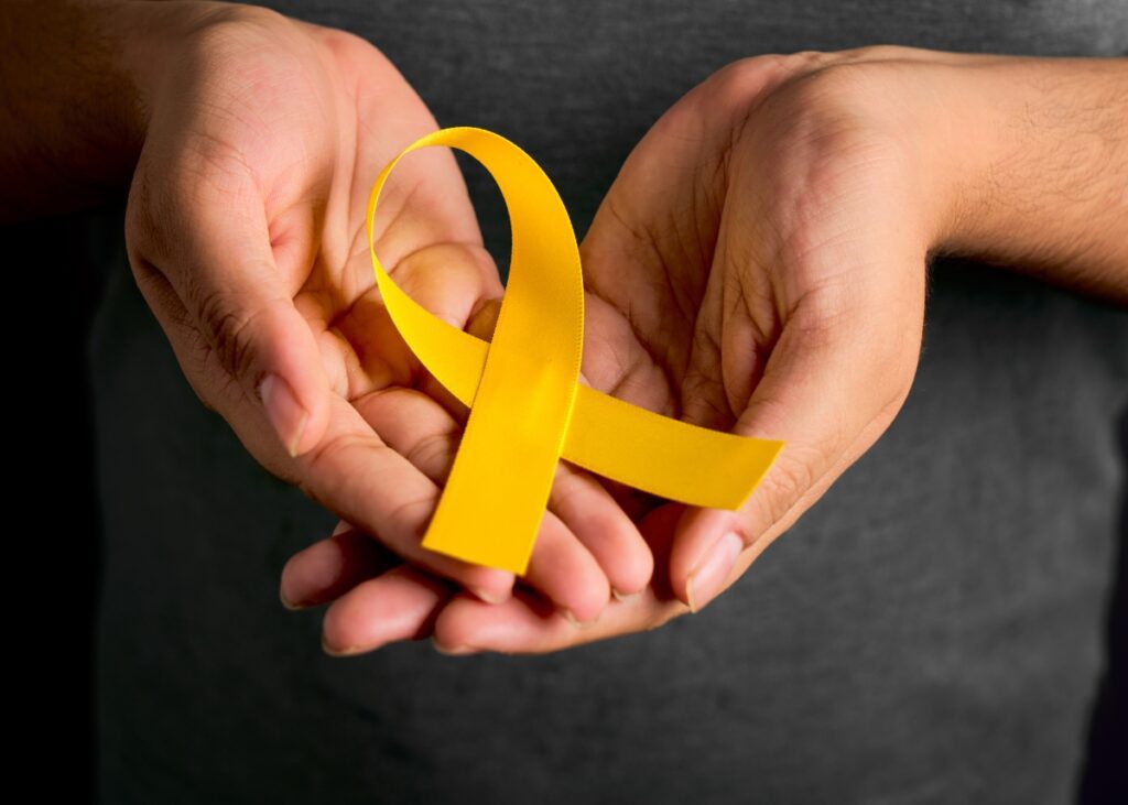 mental health suicide prevention month ribbon in someones hand