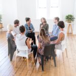 a group of advisors speaking in a circle