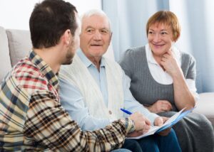 a couple talking to their lawyer checking in on their estate planning and beneficiaries