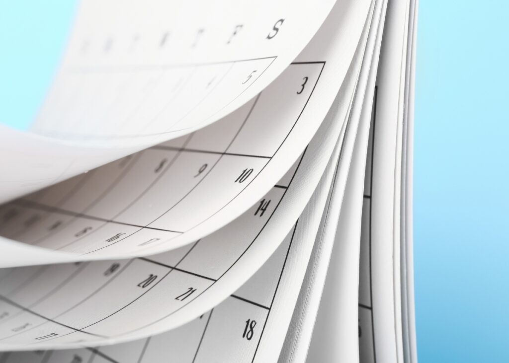 a calendar flipping to the year end for the end of year review