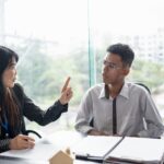 an advisor speaking to their clients on how they can protect their business