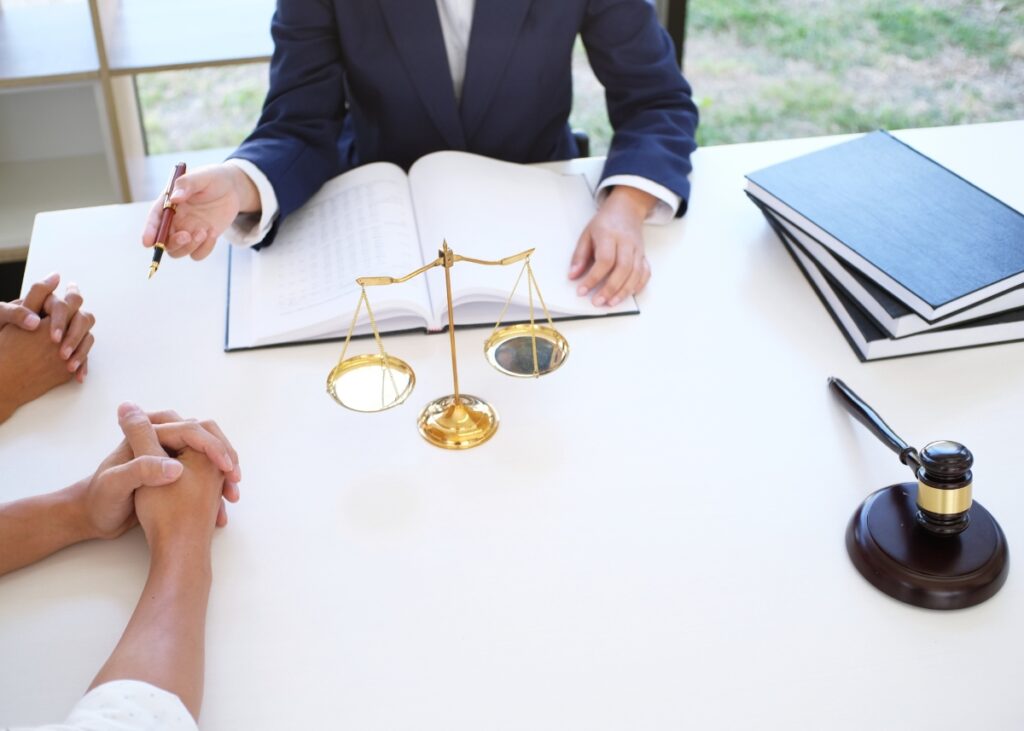 a parent and their young adult planning with a lawyer