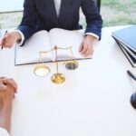 a parent and their young adult planning with a lawyer