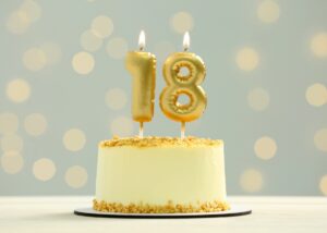 a cake that has 18 candles on it