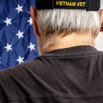 a vietnam vet saluting a flag