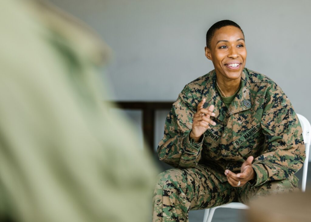 a picture of a veteran in a group talking