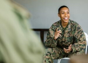 a picture of a veteran in a group talking