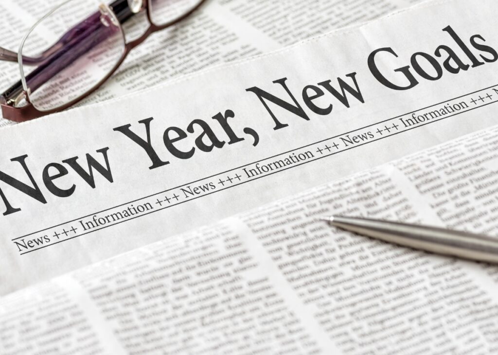 A picture of a newspaper that says new year, new goals
