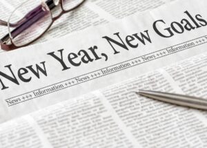 A picture of a newspaper that says new year, new goals