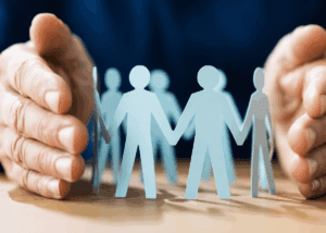 Trustee protecting family members with arms around them.