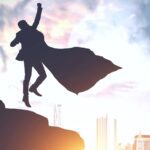 super business person jumping and punching up.